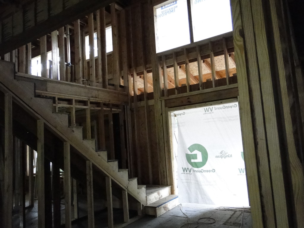 The new foyer and stairs! The original foyer ceiling height was 7' and is now at 18'!